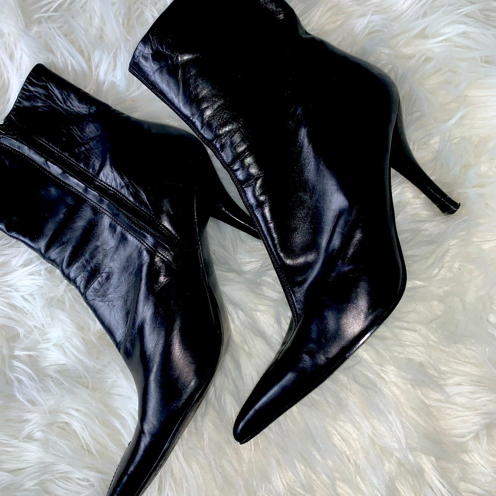 Black leather pointy toe boots